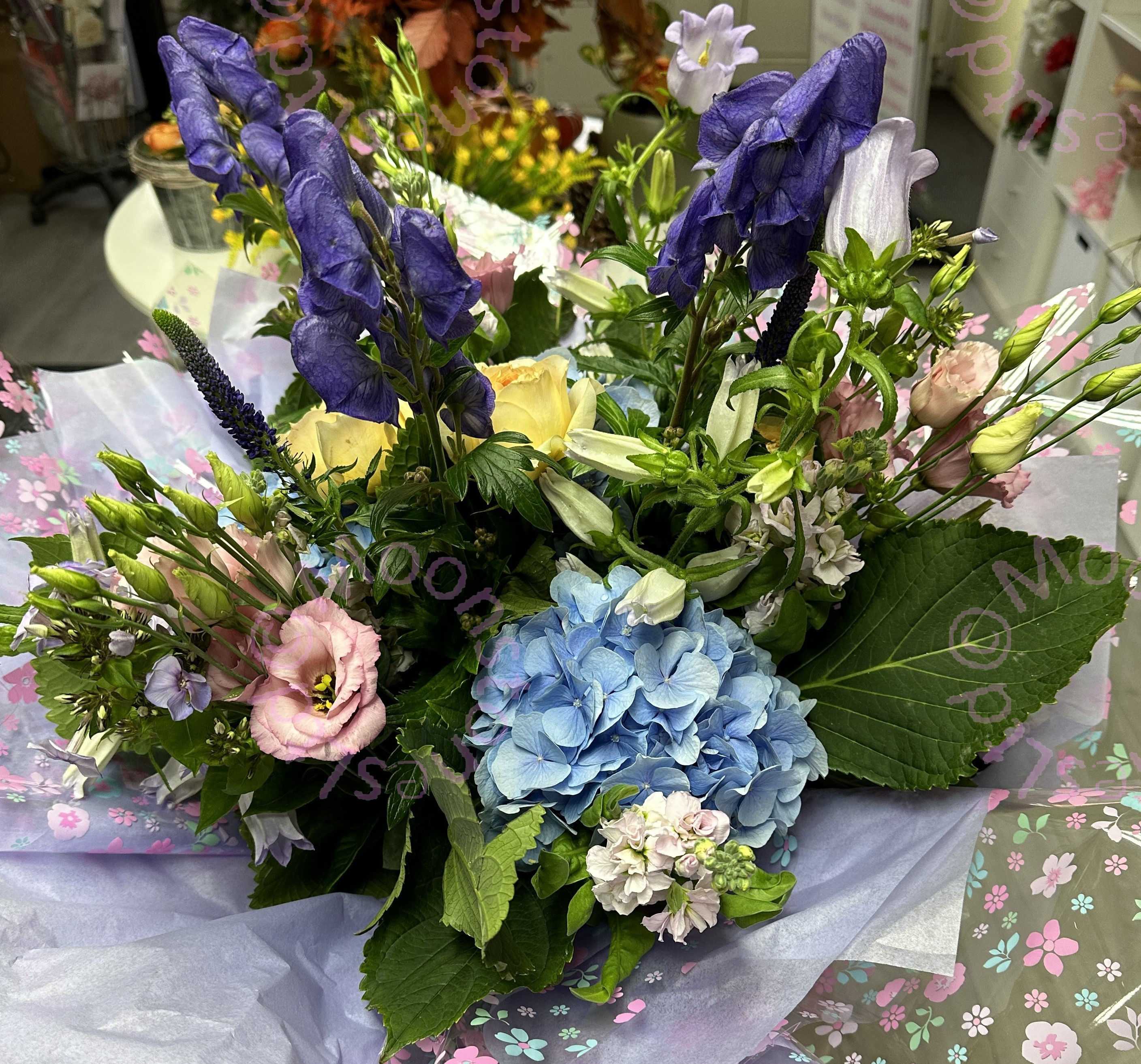 A hand tied bouquet of pastel flowers by moonstones florist, fareham 